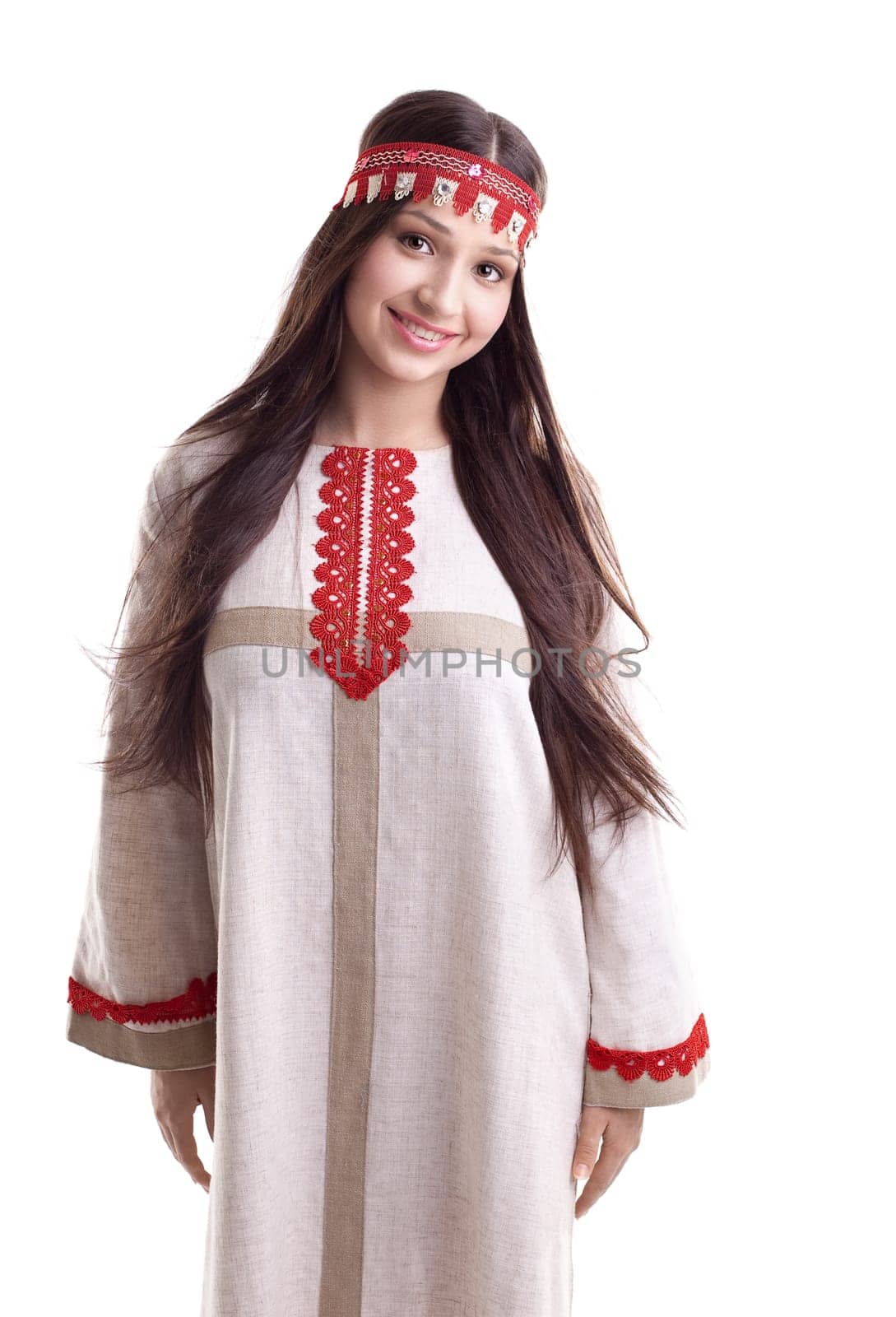 Young girl in dance pose - flax traditional russian costume