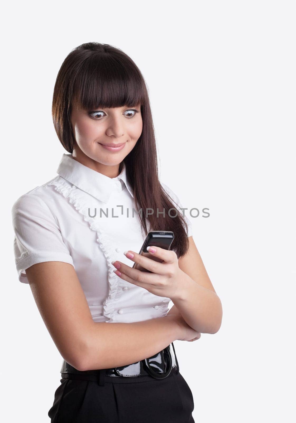 Happy wonder young business woman look at cell phone isolated