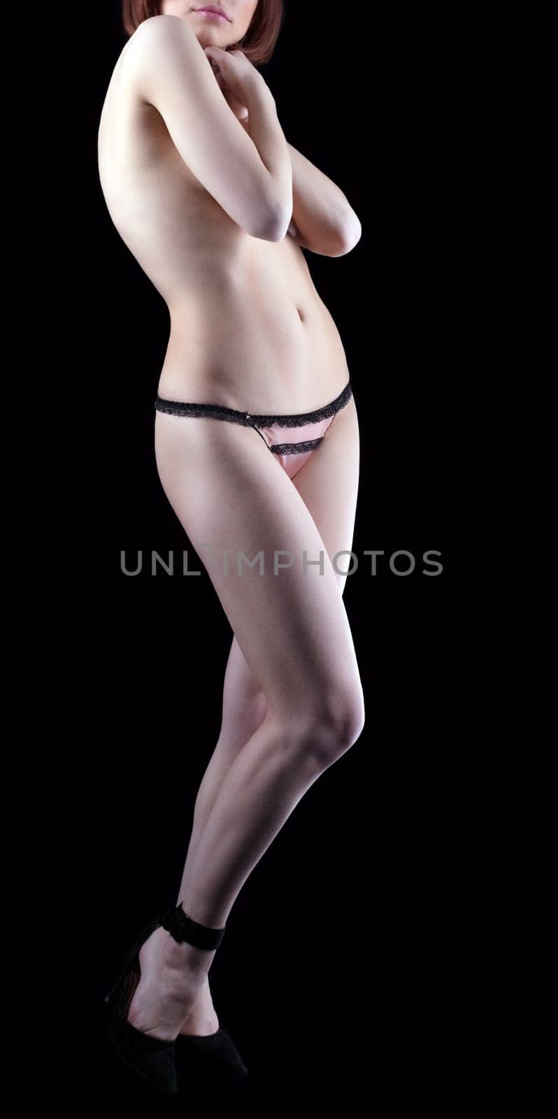 Beauty young nude woman sit in dark