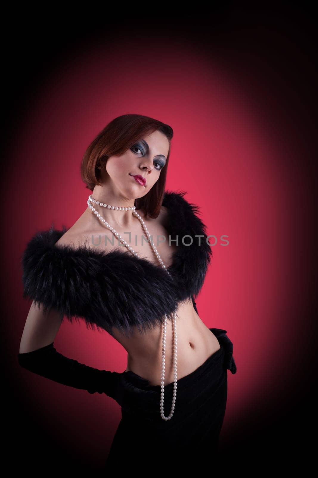 Woman portrait with fur boa in retro style make-up