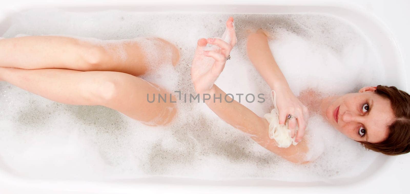 Young woman in bathtub