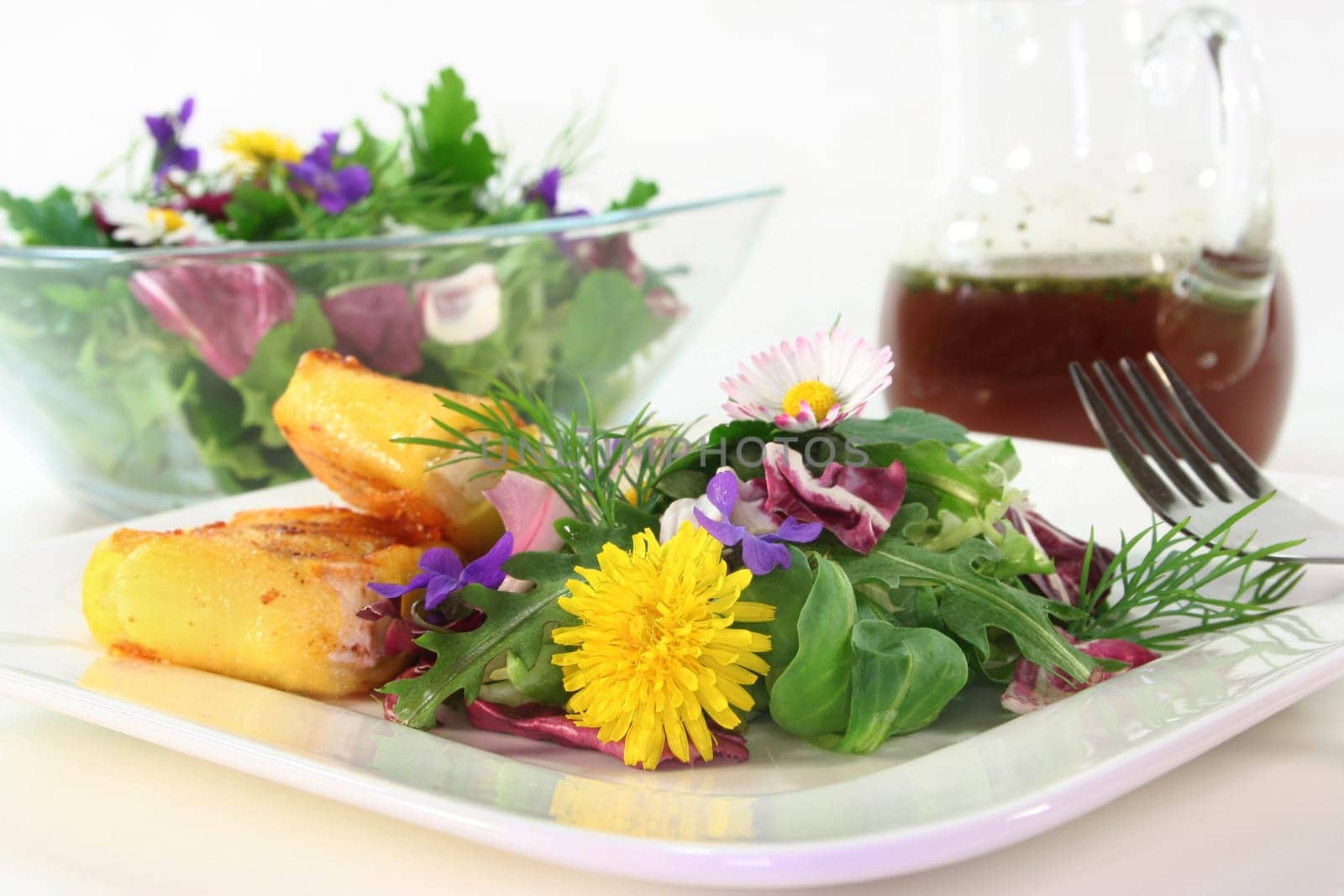 Wild herb salad with goat's cheese baked in a potato coat