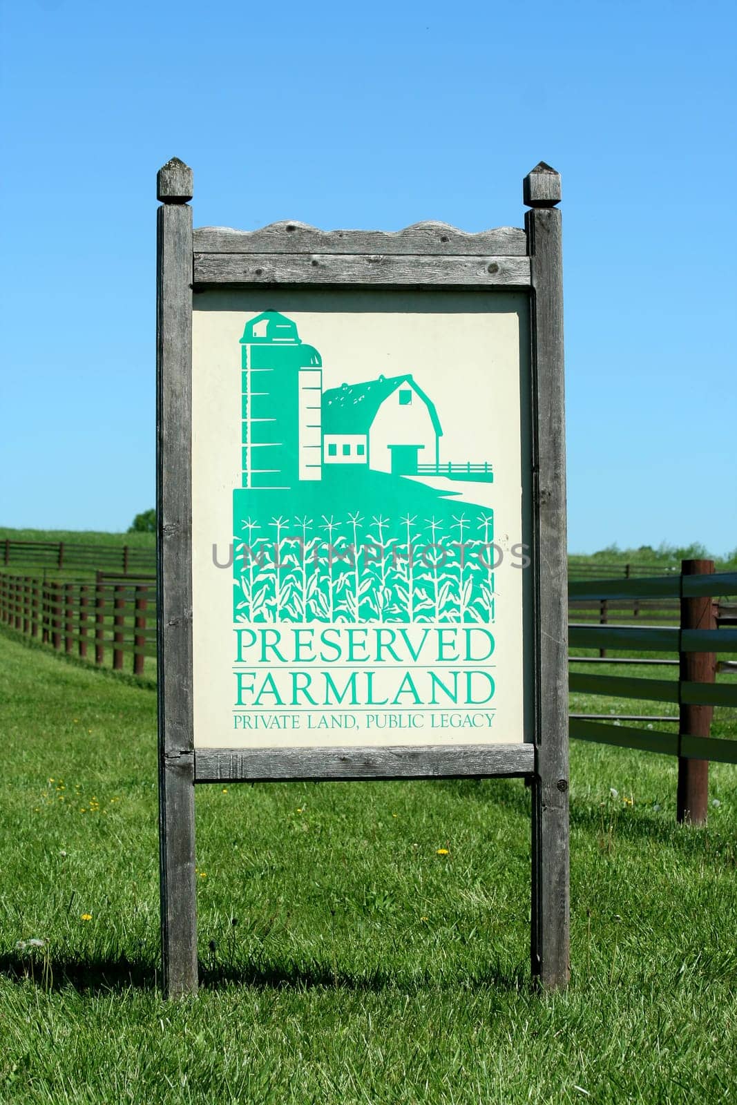 A Preserved farmland sign with grass and sky