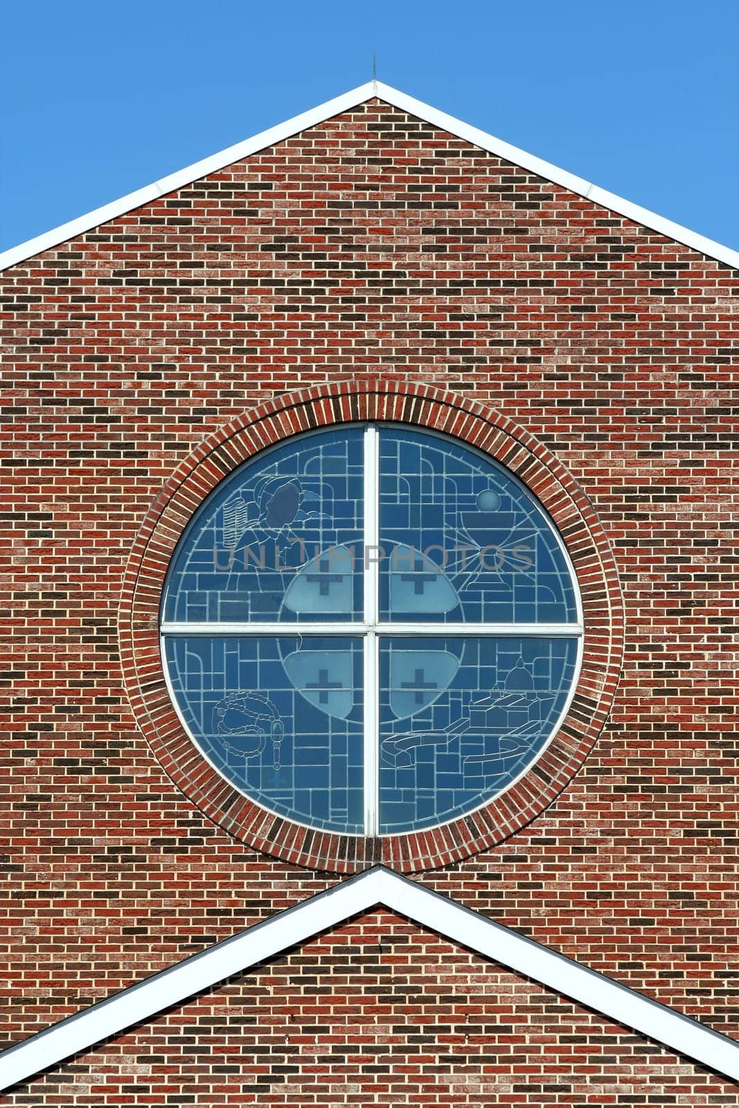 Stained glass windows with brick background