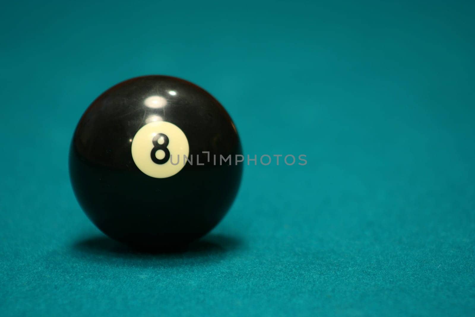 8 ball on green pool table