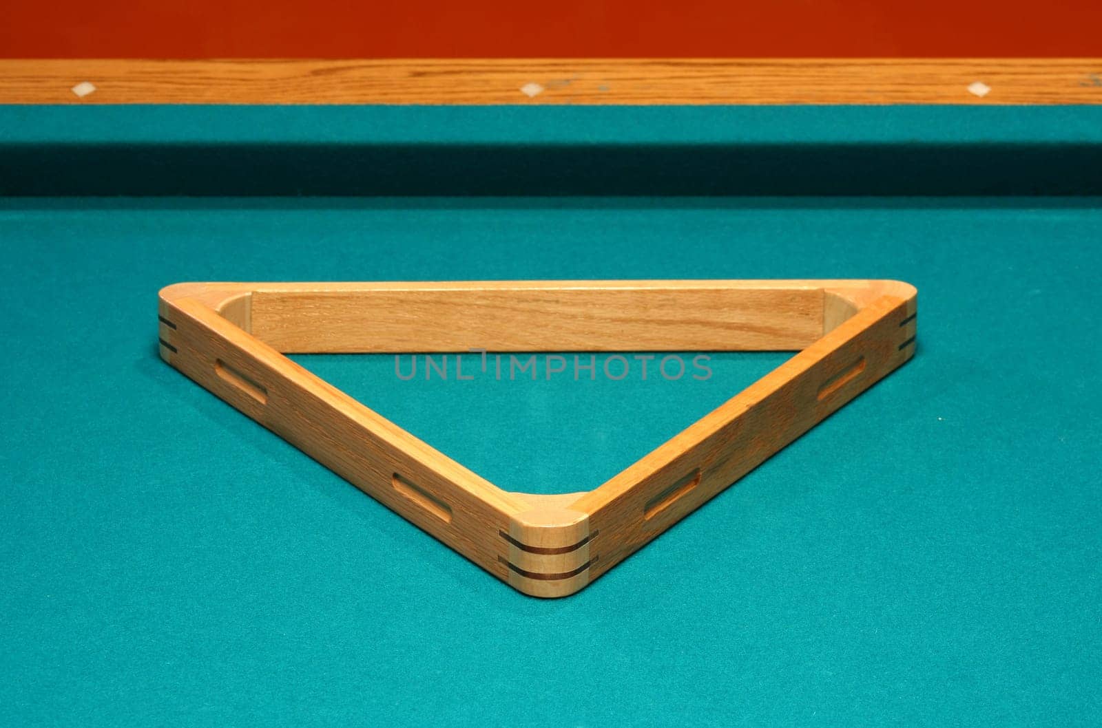 Empty 8 ball rack on a pool table