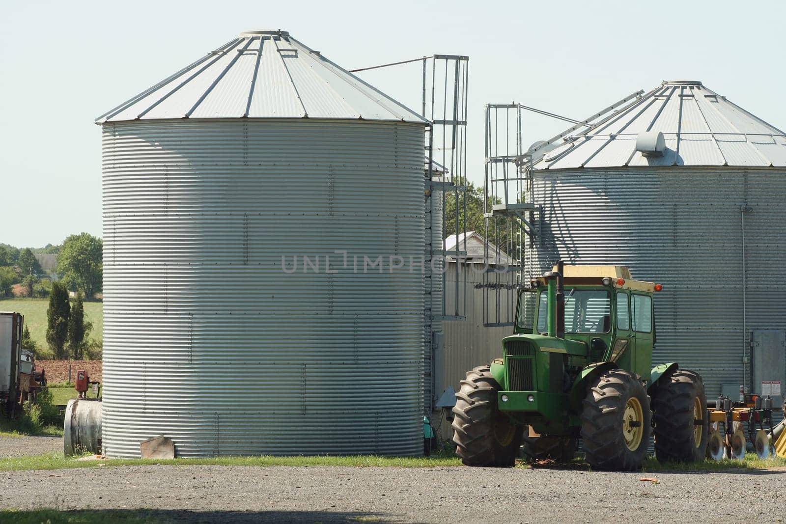 Green Farm Tractor and silos