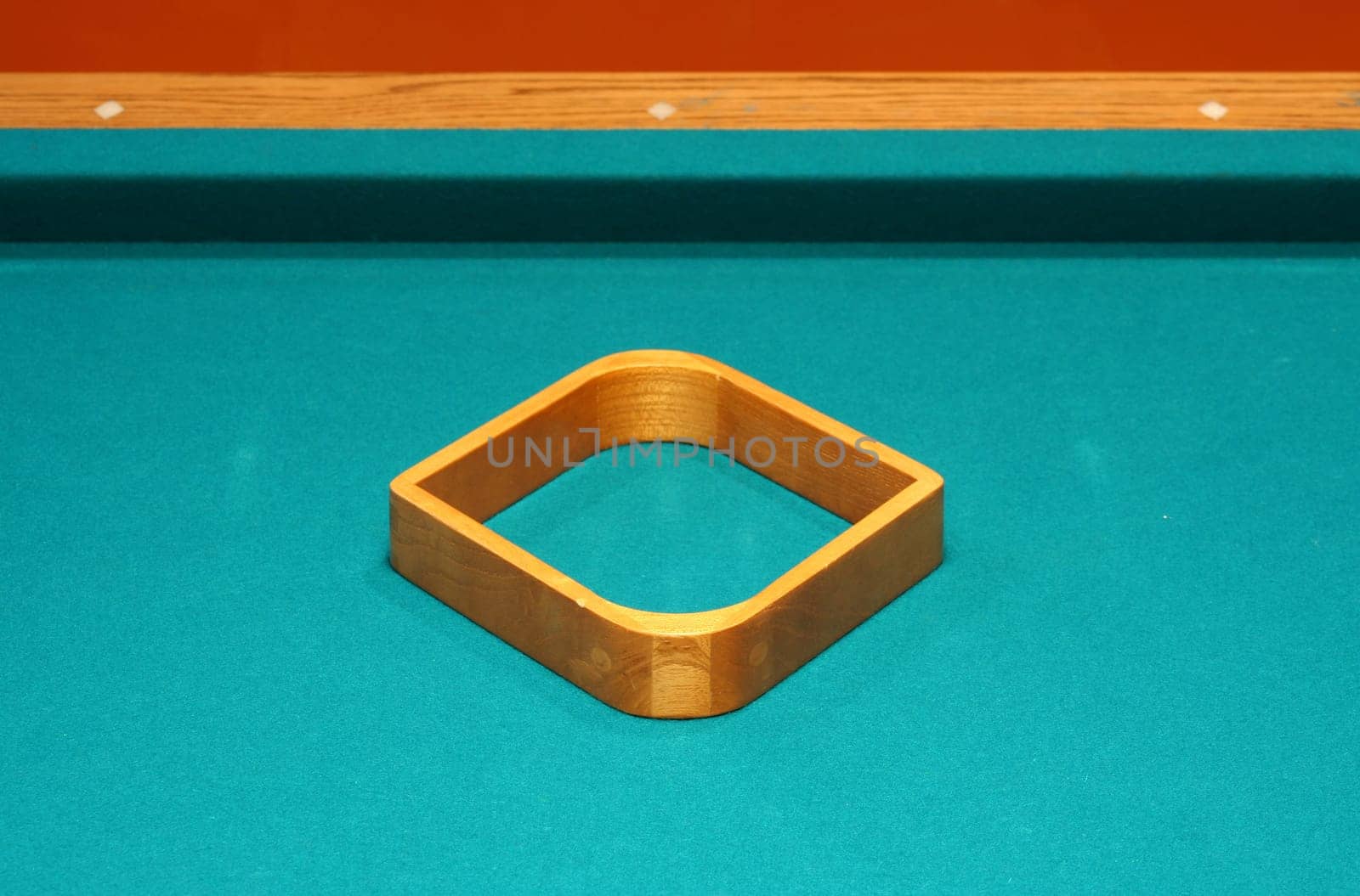 Empty 9 ball rack on a pool table