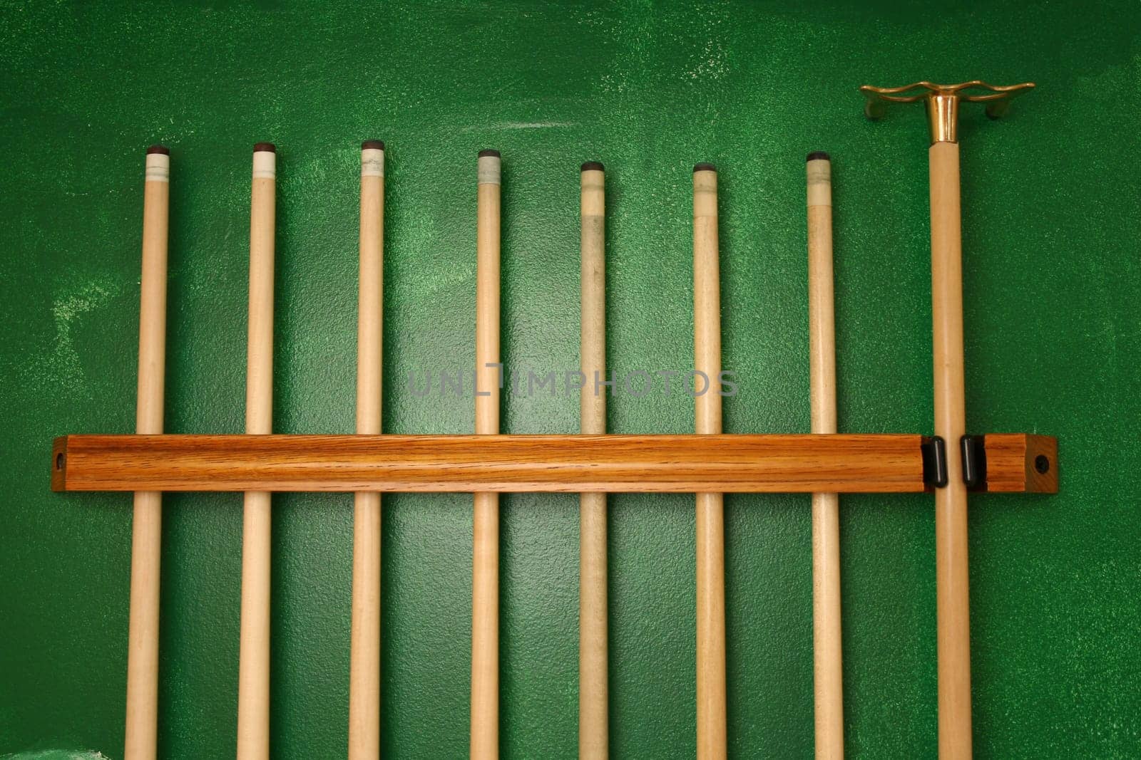 Pool Cues in a wall rack