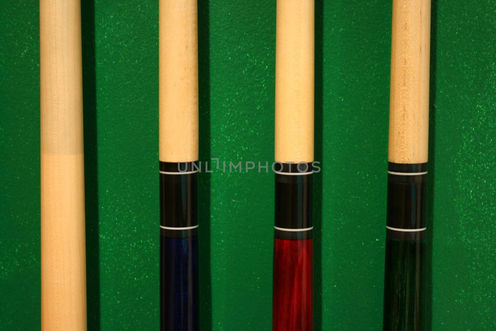 Pool Cues in a wall rack