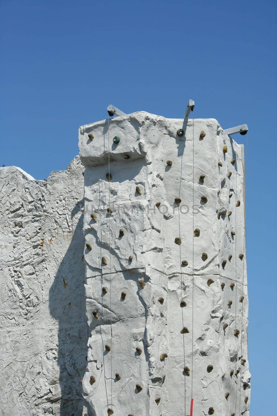 A Rock Climbing Wall against a blue sky