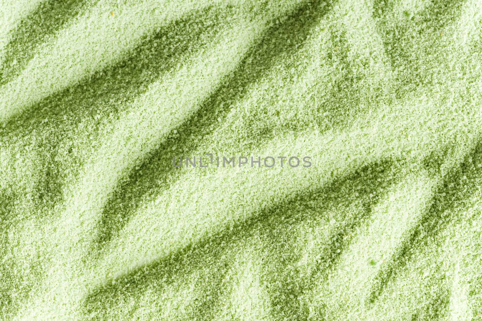 Close-up of green sand with strong contrast pattern