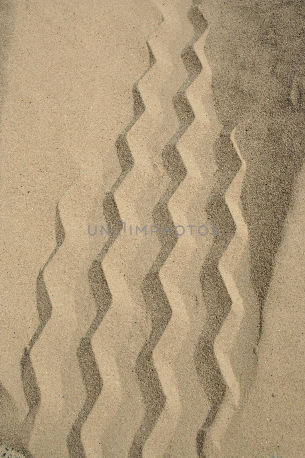 Rough sand meeting smooth sand