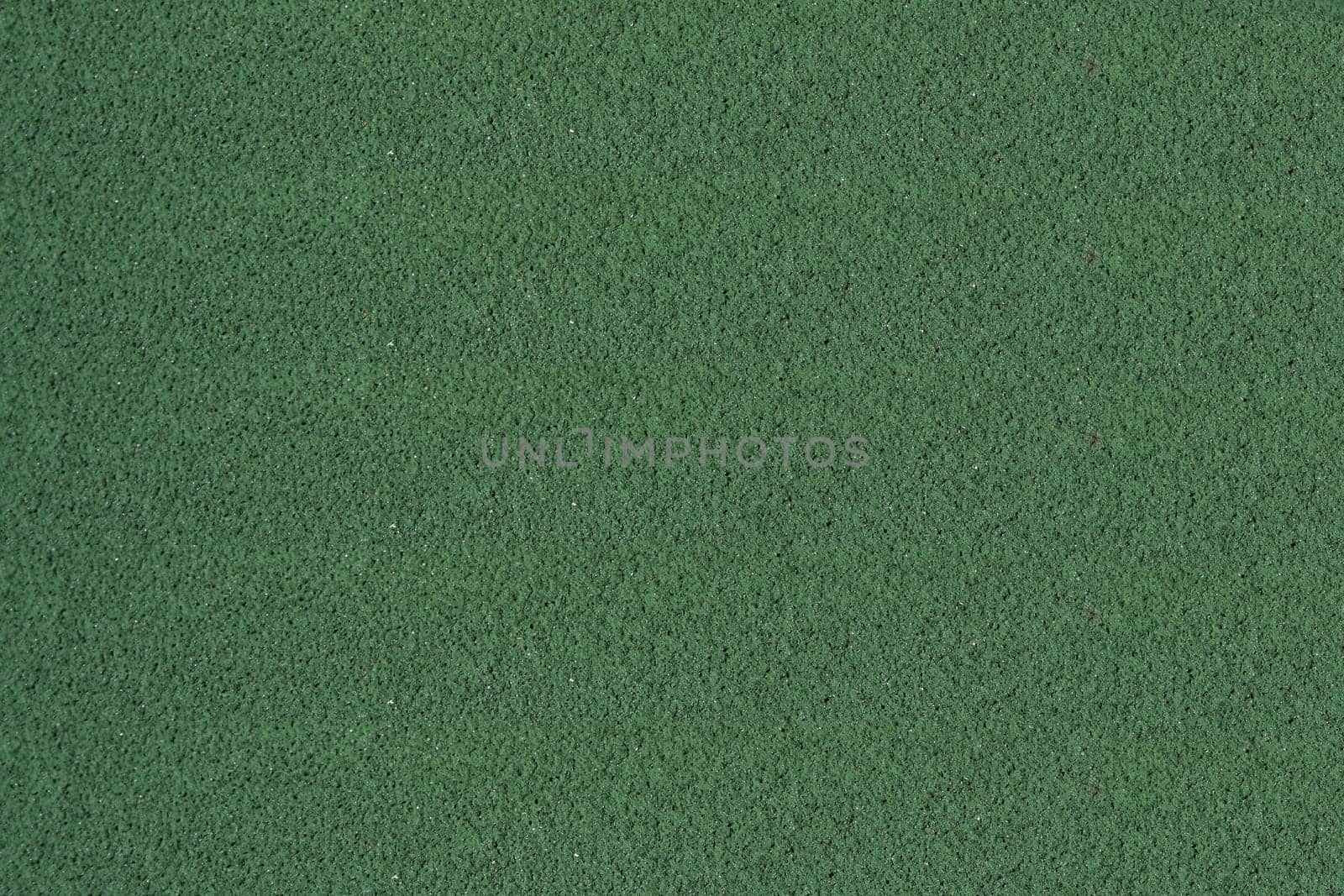 A Tennis ball on a green court
