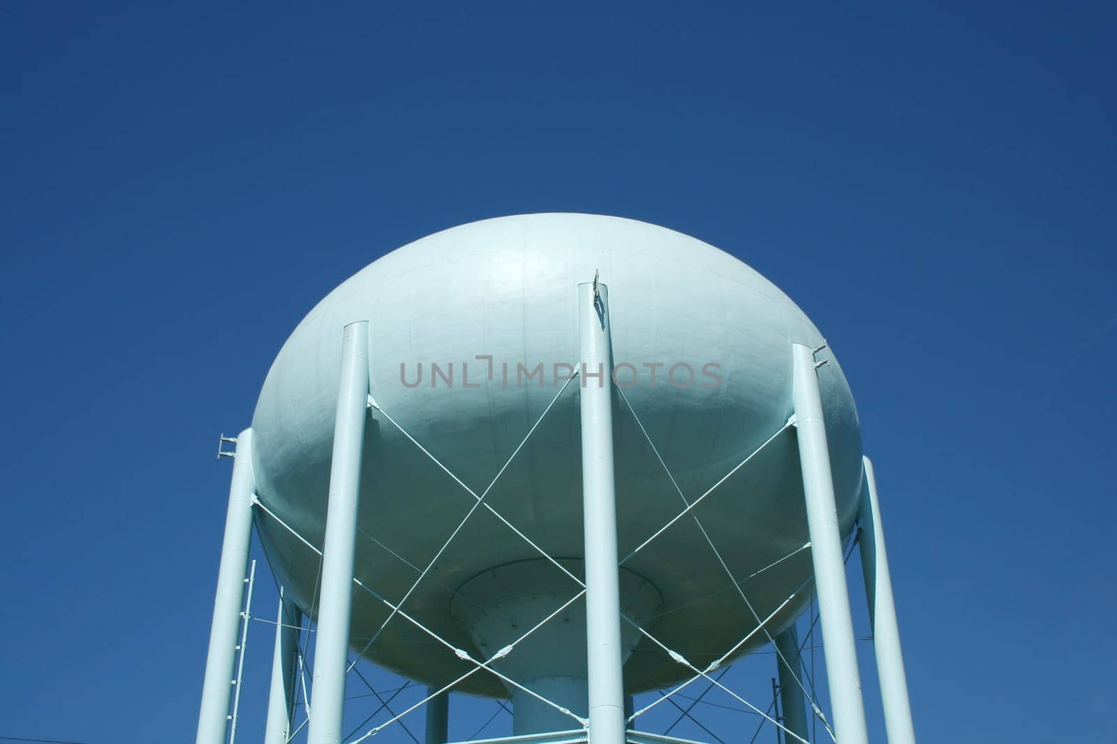Blue Water Tower against a blue sky