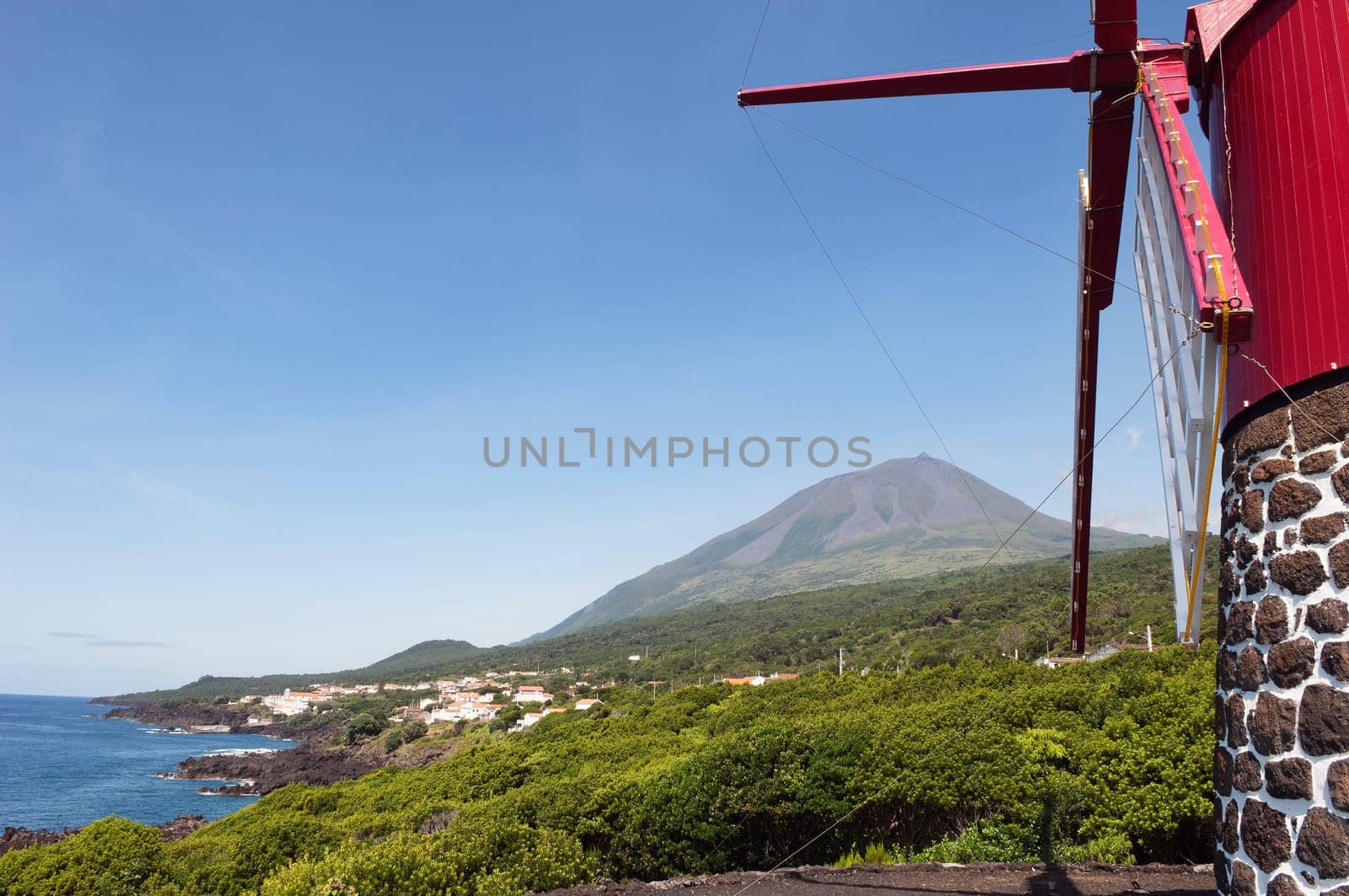 Red windmill in the coast of Pico island, Azores