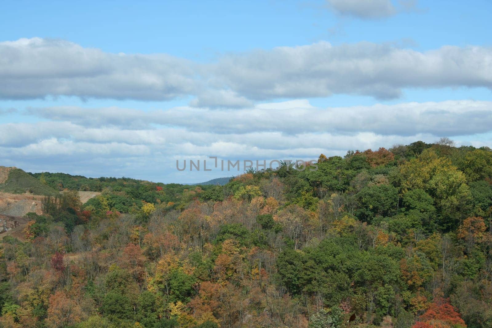 A mountain with changing leaves and sky