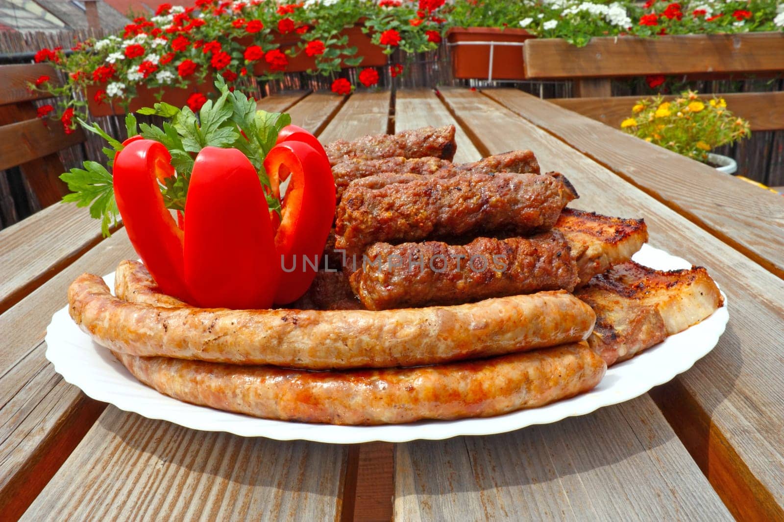 Prepared meat from the grill, ready for eating, with red pepper