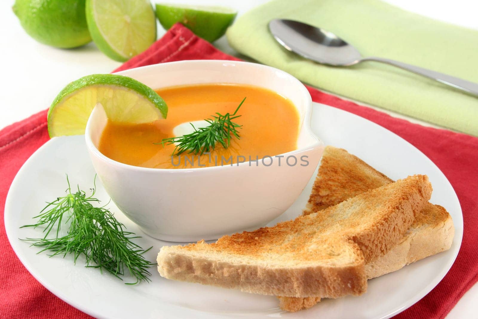 a bowl of salmon cream soup with cream and dill