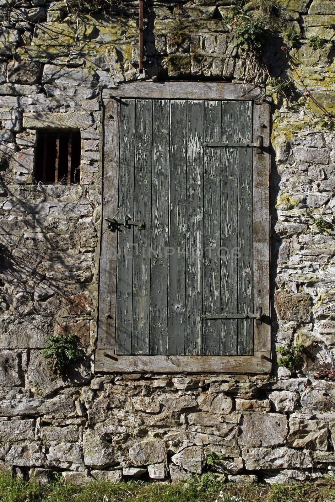 Wall with wooden door and window
