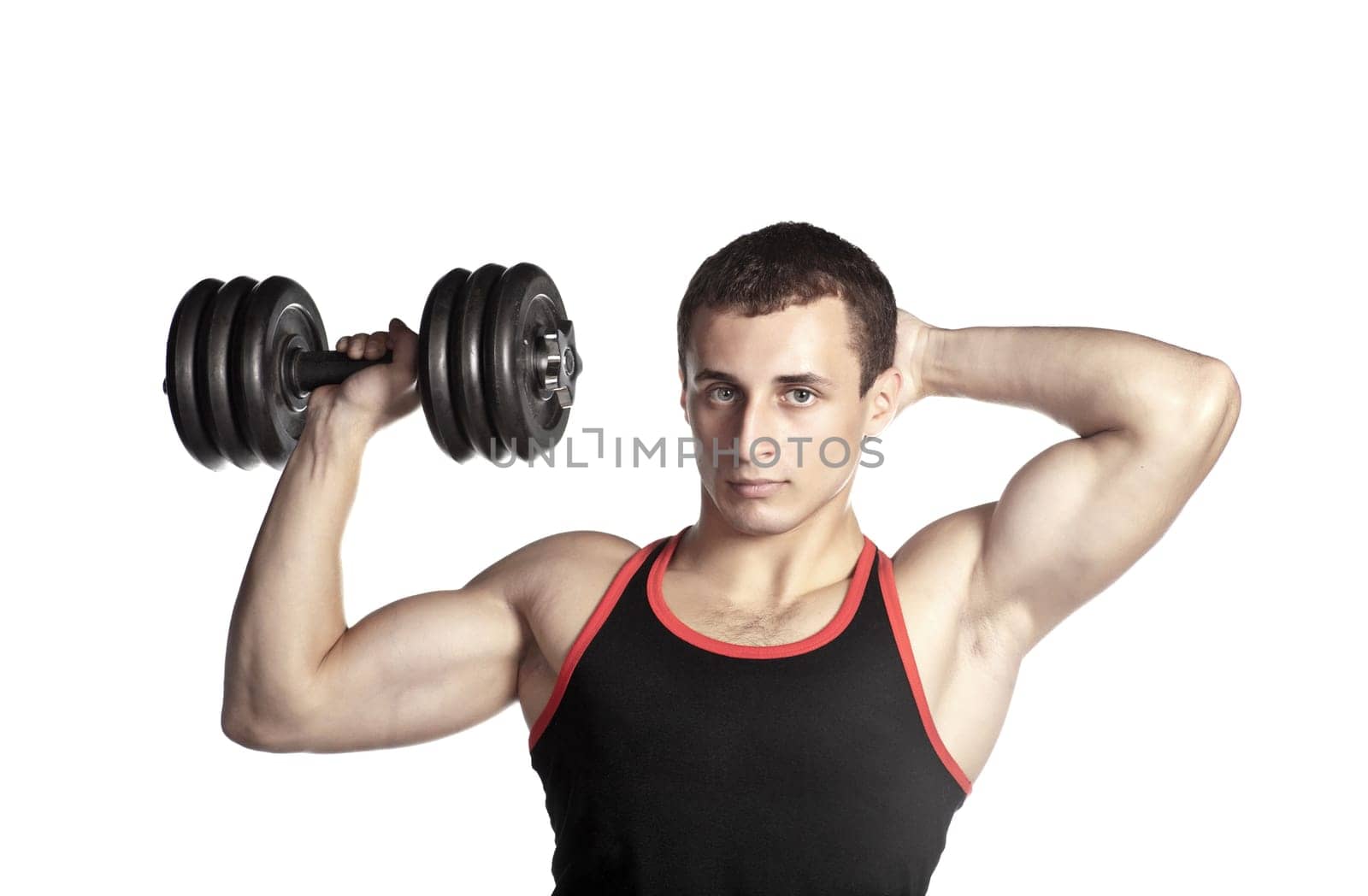handsome guy in black-and-red undershirt holding dumbbell (low saturation toning)