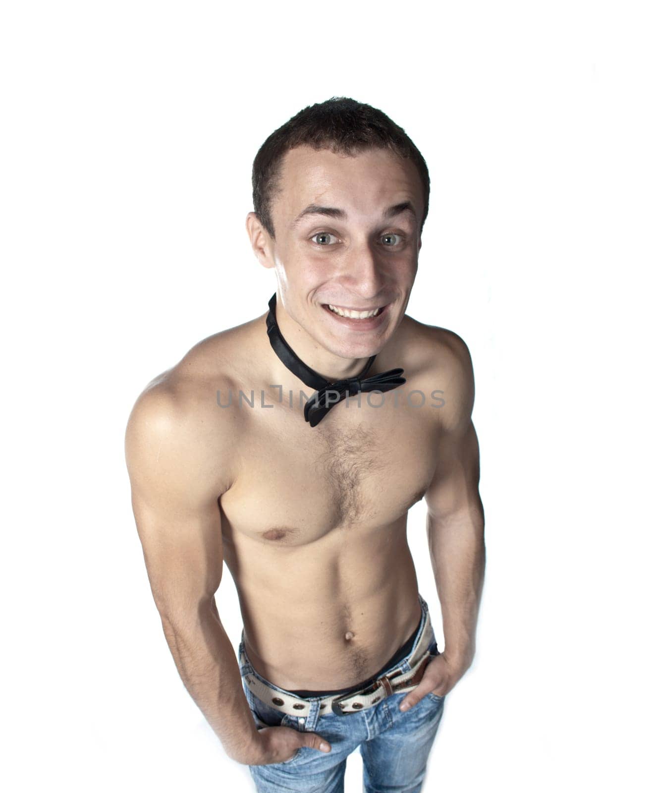handsome guy shirtless with bow tie having fun (low saturation toning)