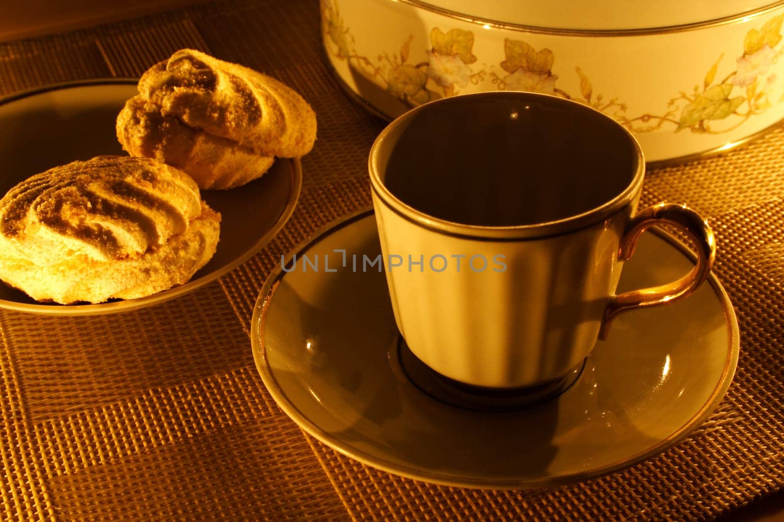 a cup of tea with zephyr on a candle light