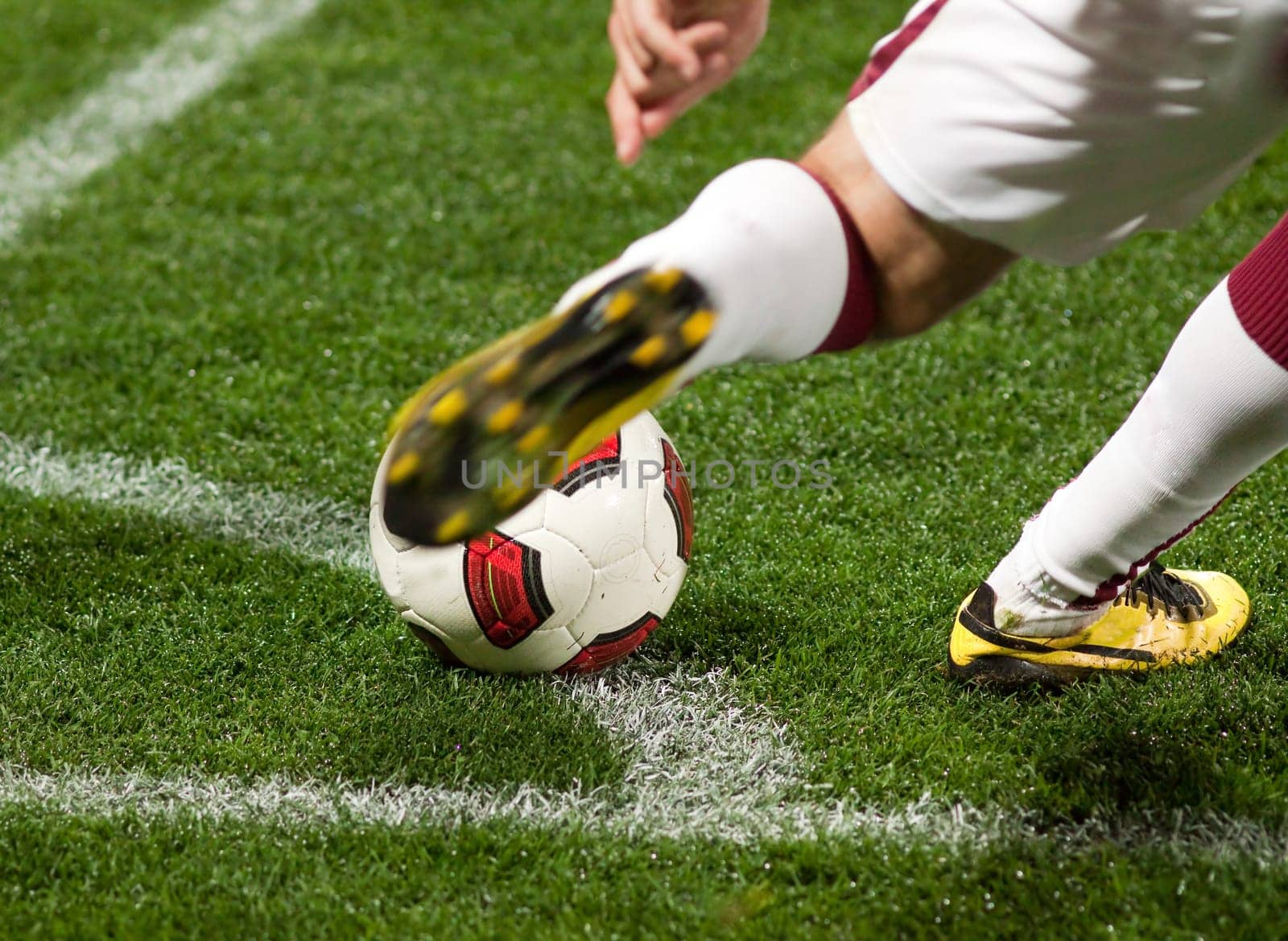 Soccer players running after the ball
