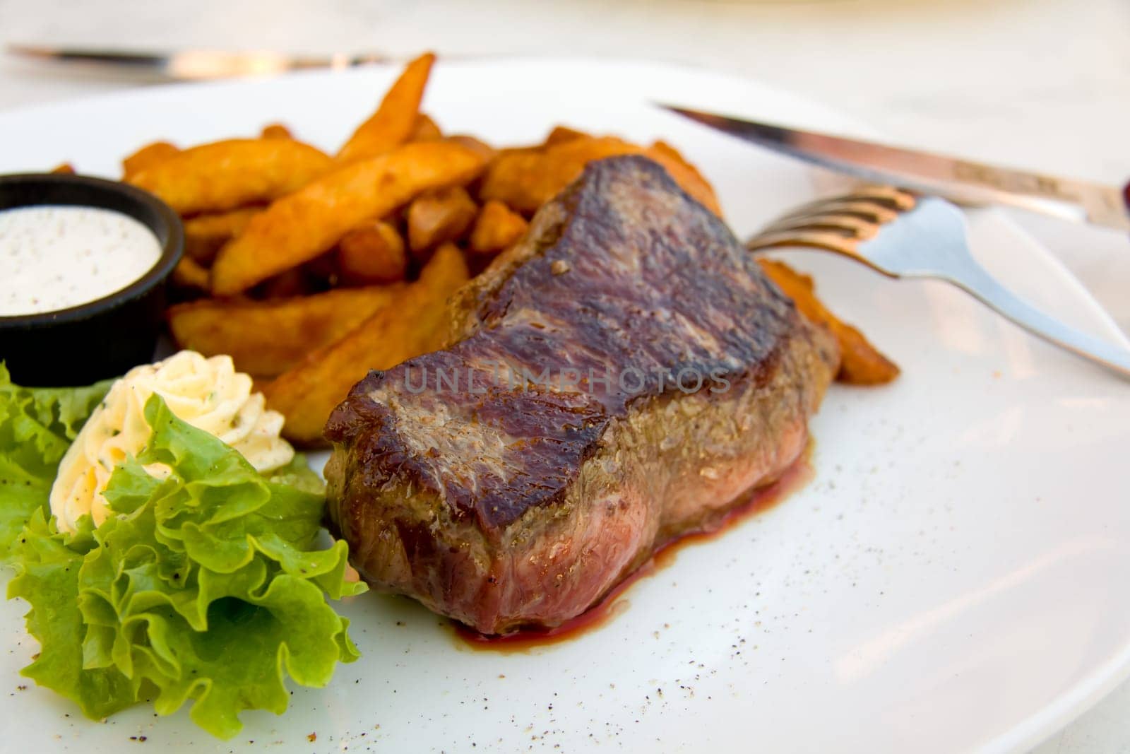 Steak with dip,potato wedges,butter