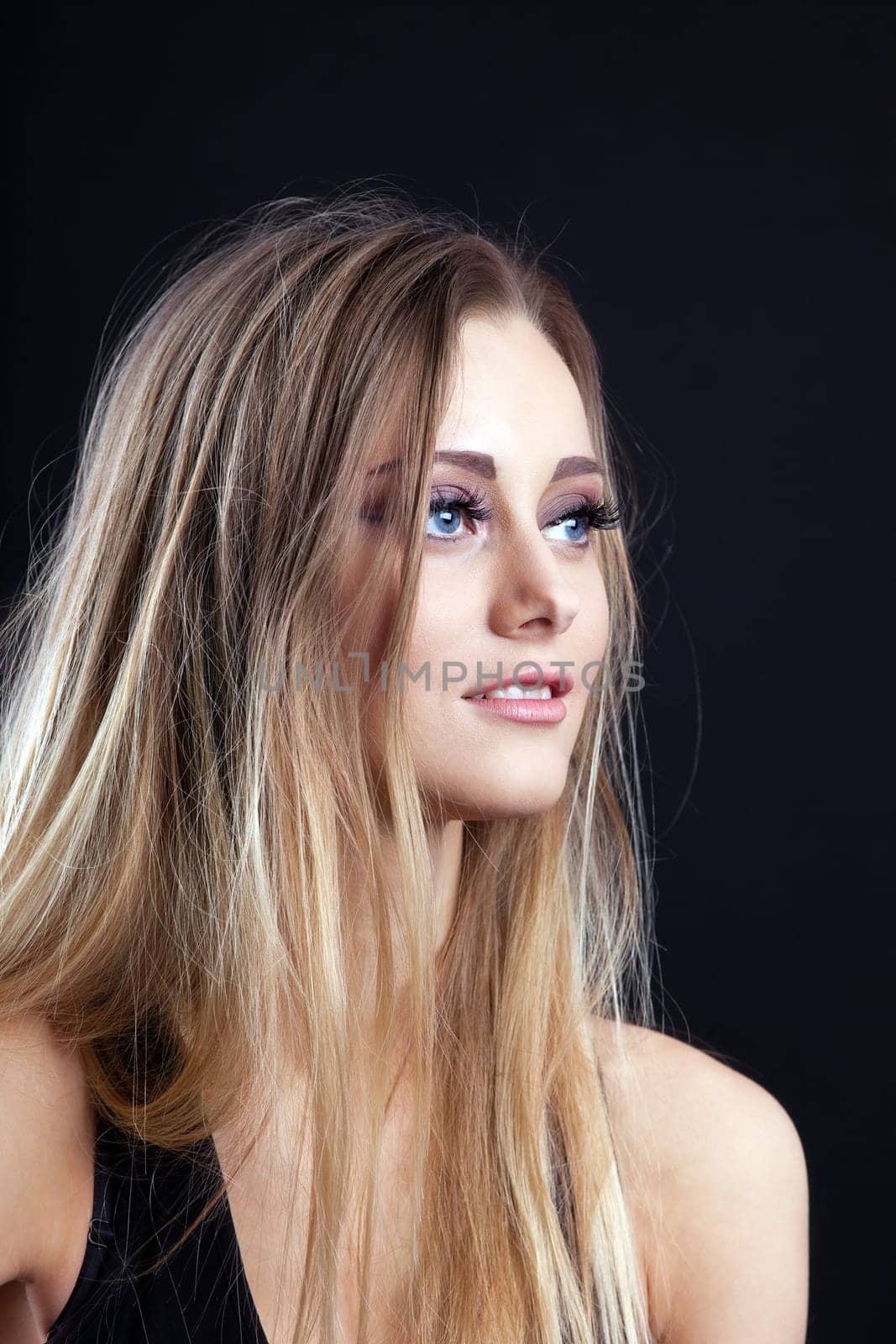 Portrait of Young beauty blond girl look at light