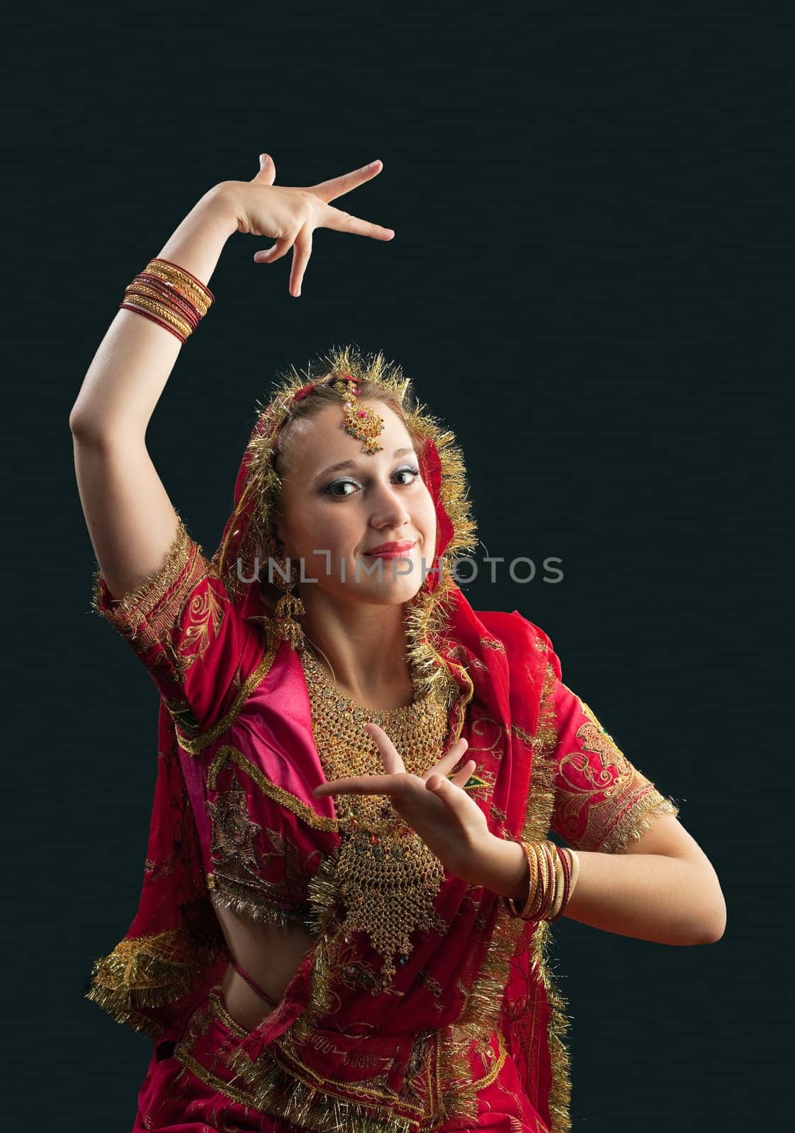 young beauty girl in rich red traditional indian costume