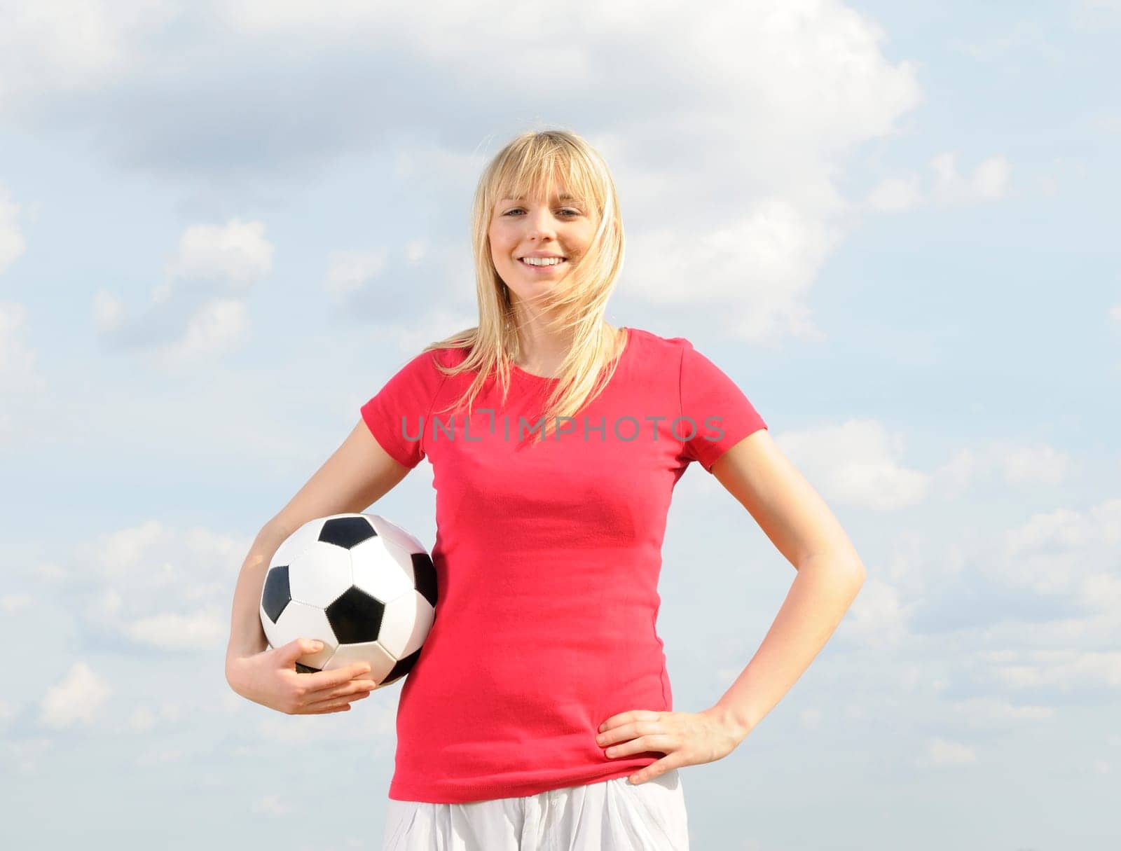 Young woman with soccer ball
