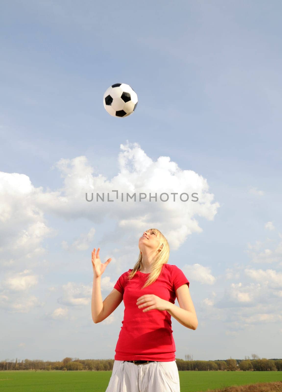 Young woman with soccer ball