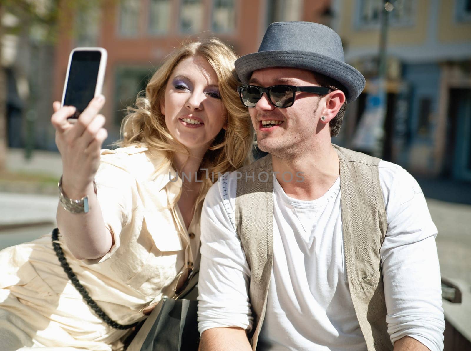 Young couple makes self portrait with a mobile phone