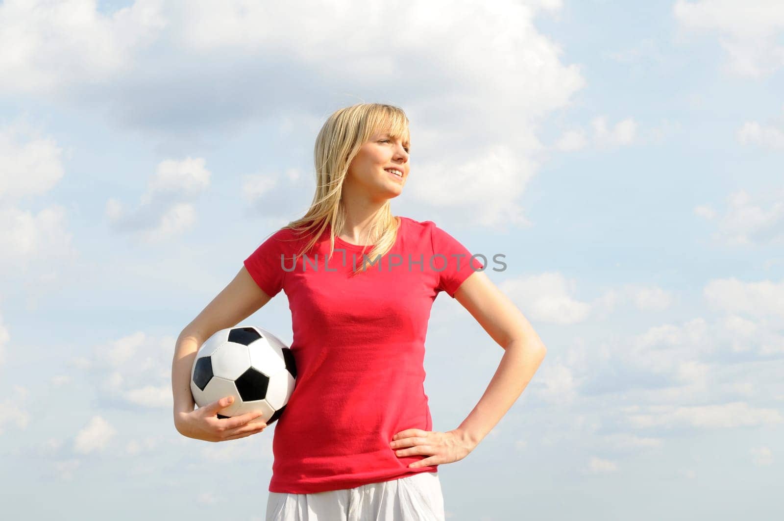 Young woman with soccer ball