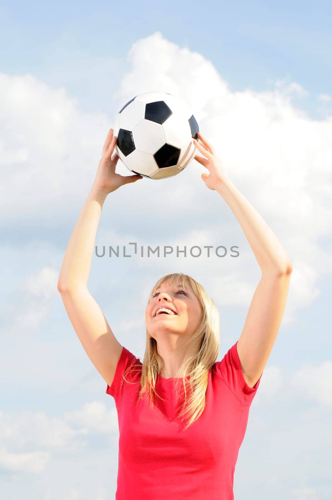 Young woman with soccer ball