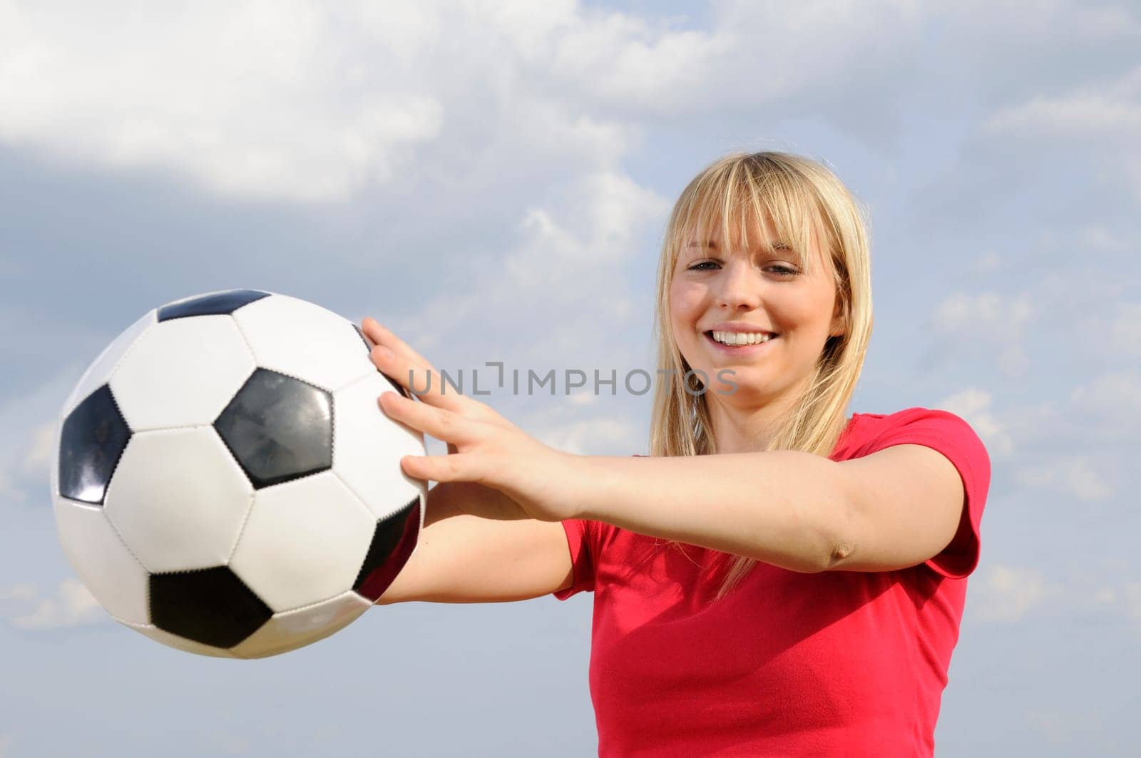 Young woman with soccer ball