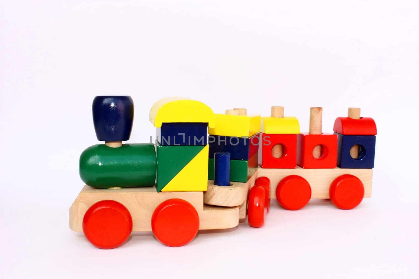A colorful wooden train toy for children, isolated