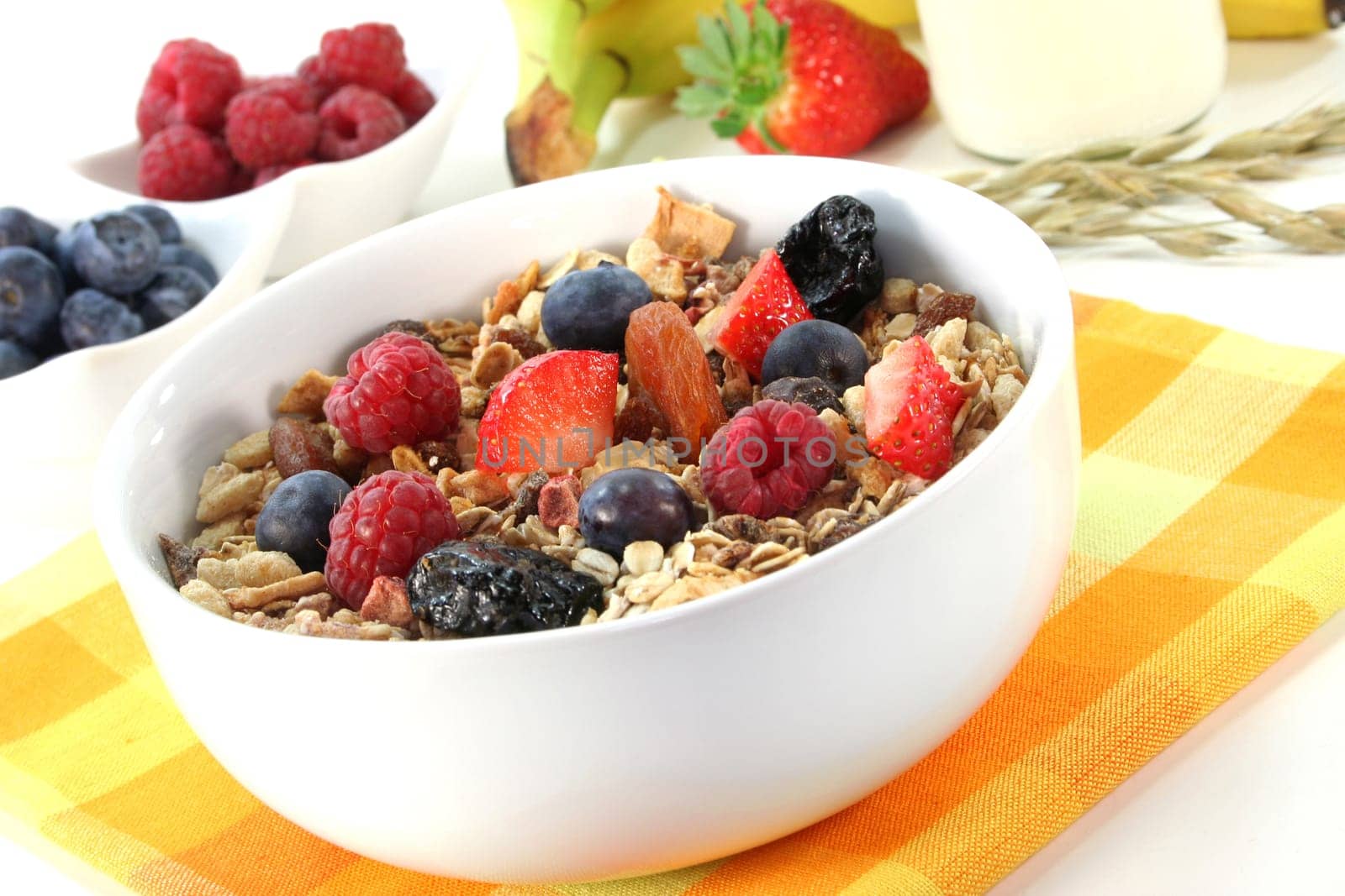 a bowl of fruit muesli with fresh berries