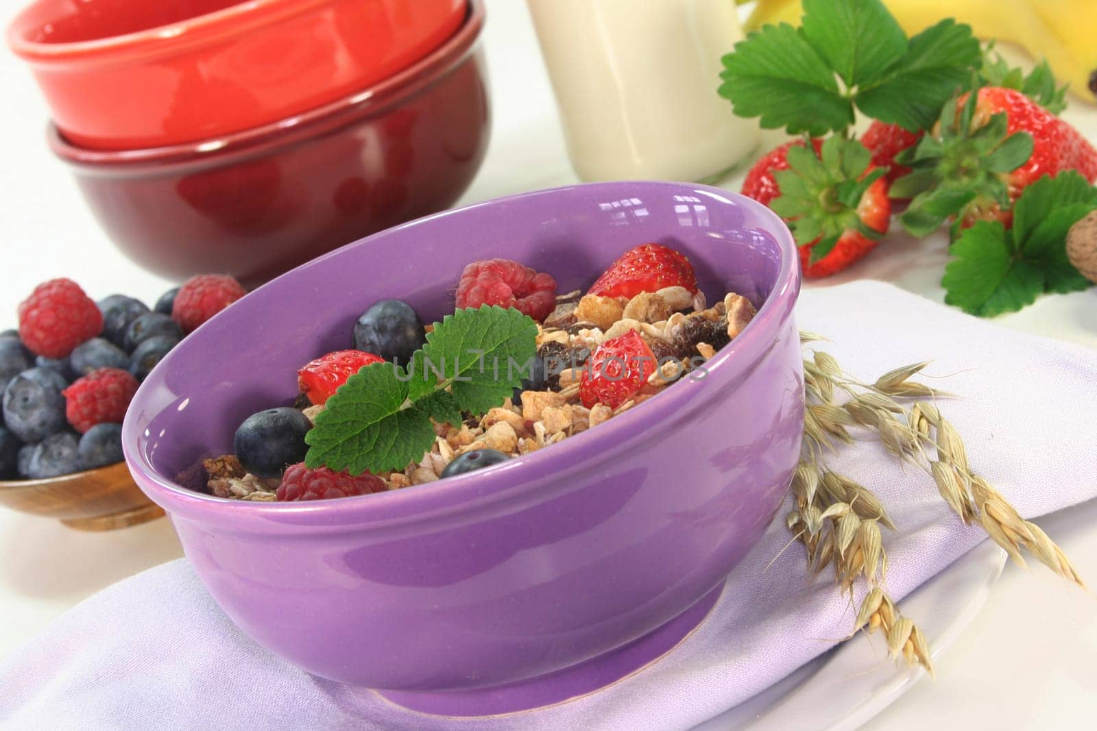 a bowl of fruit muesli with fresh berries