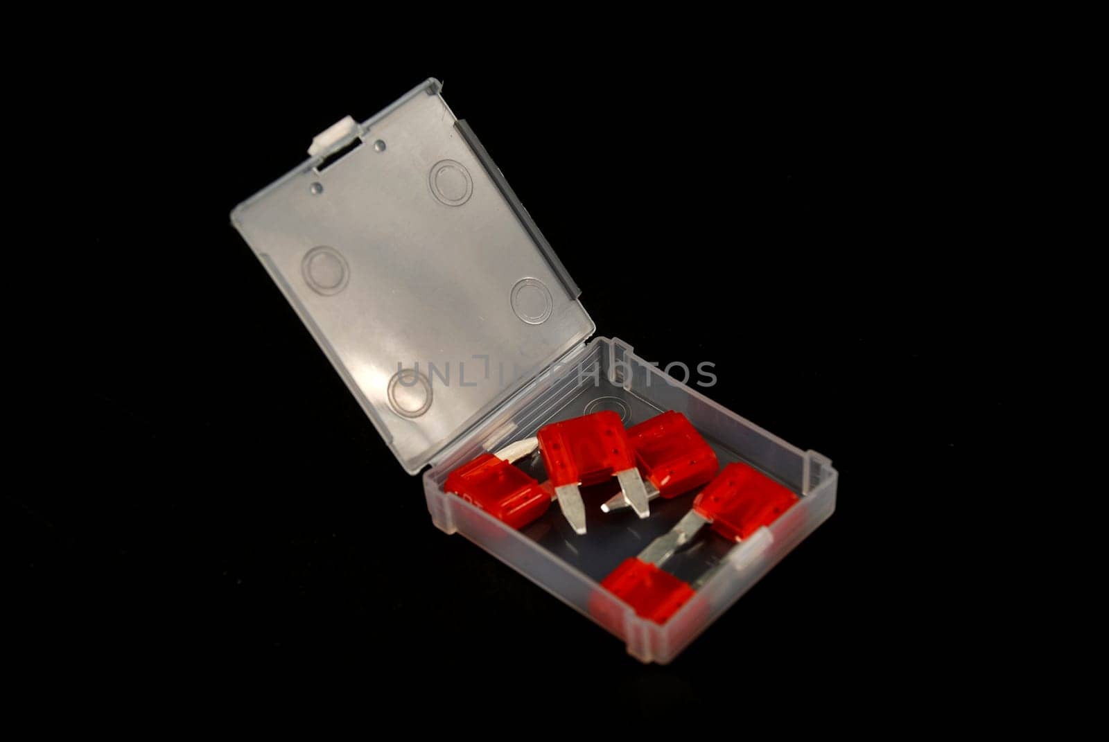 electrical automobile fuses with shallow depth of field on black background