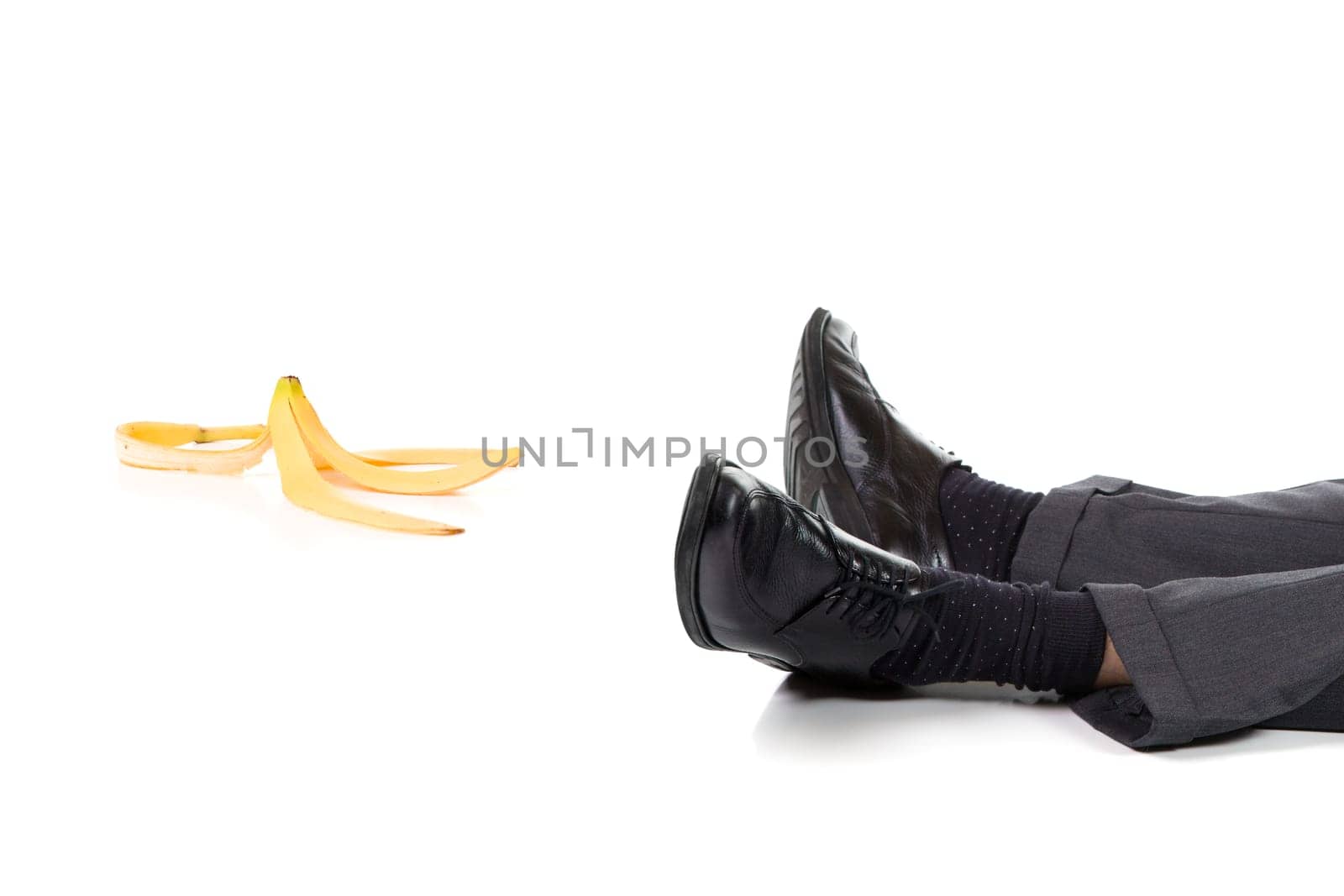 A scene of a slip and fall accident with banana peel. Isolated on white background
