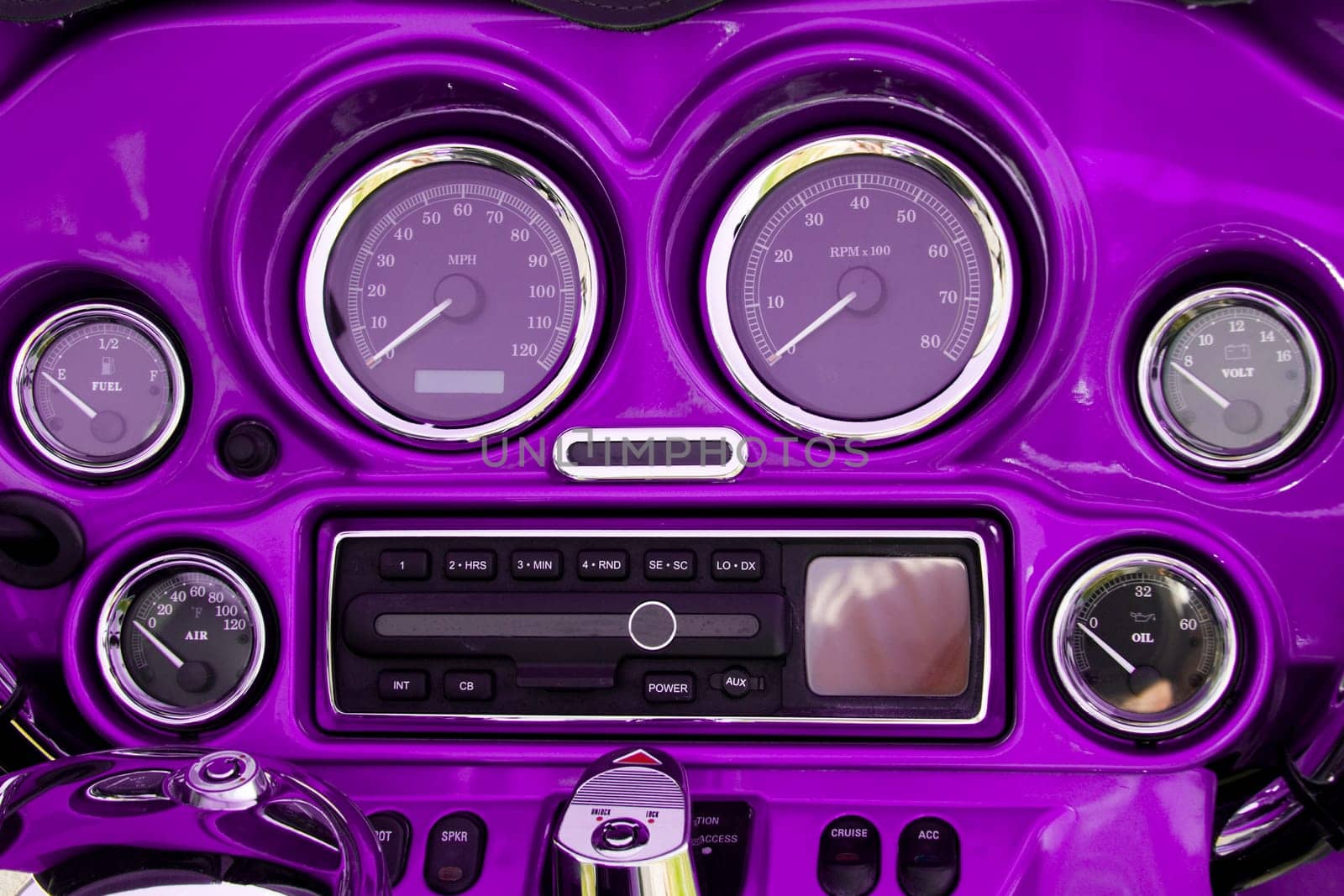 Close-up view of bright purple motorcycle dashboard