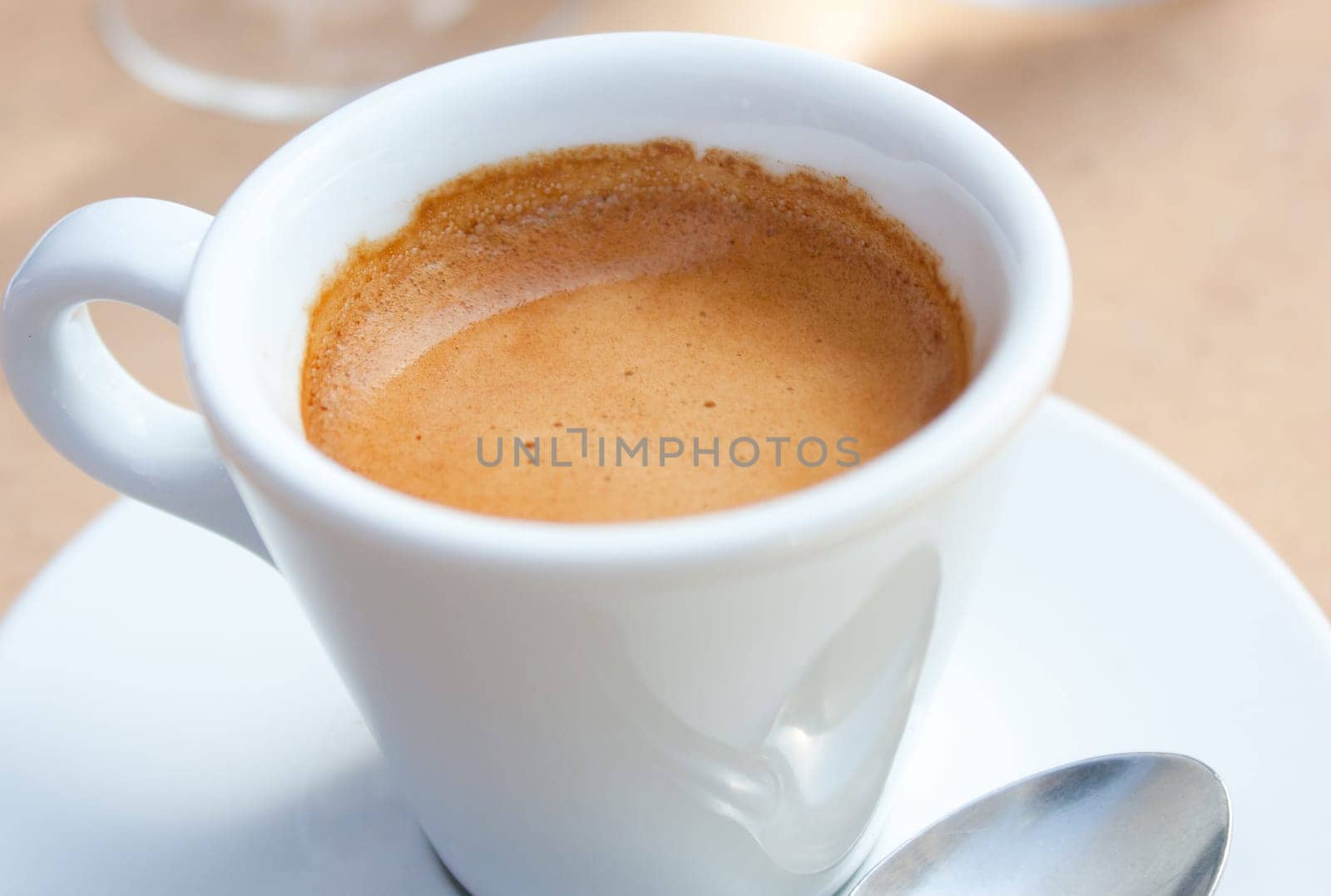 Close-up view of a white cup of coffee, espresso