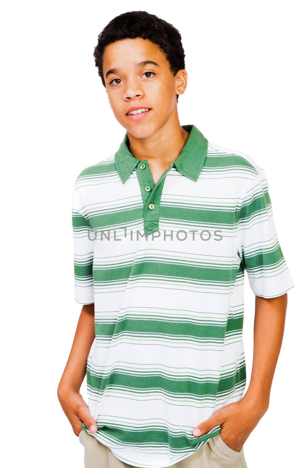 Teenage boy standing with his hands in his pockets isolated over white