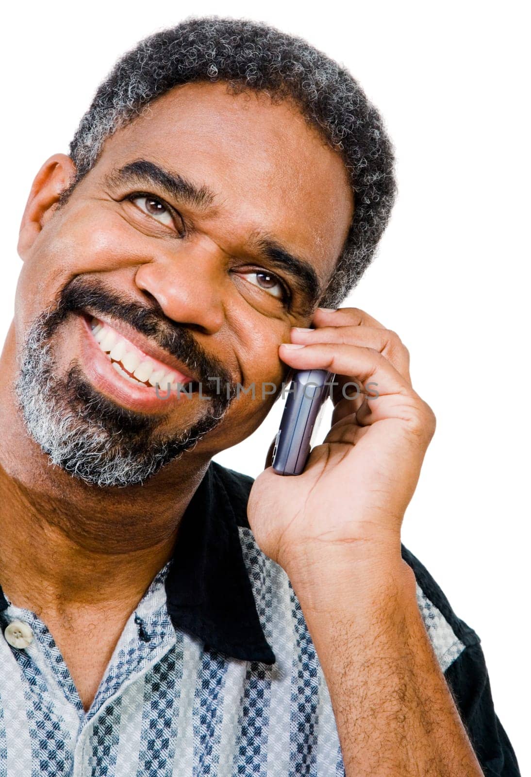 Close-up of a man talking on a mobile phone isolated over white