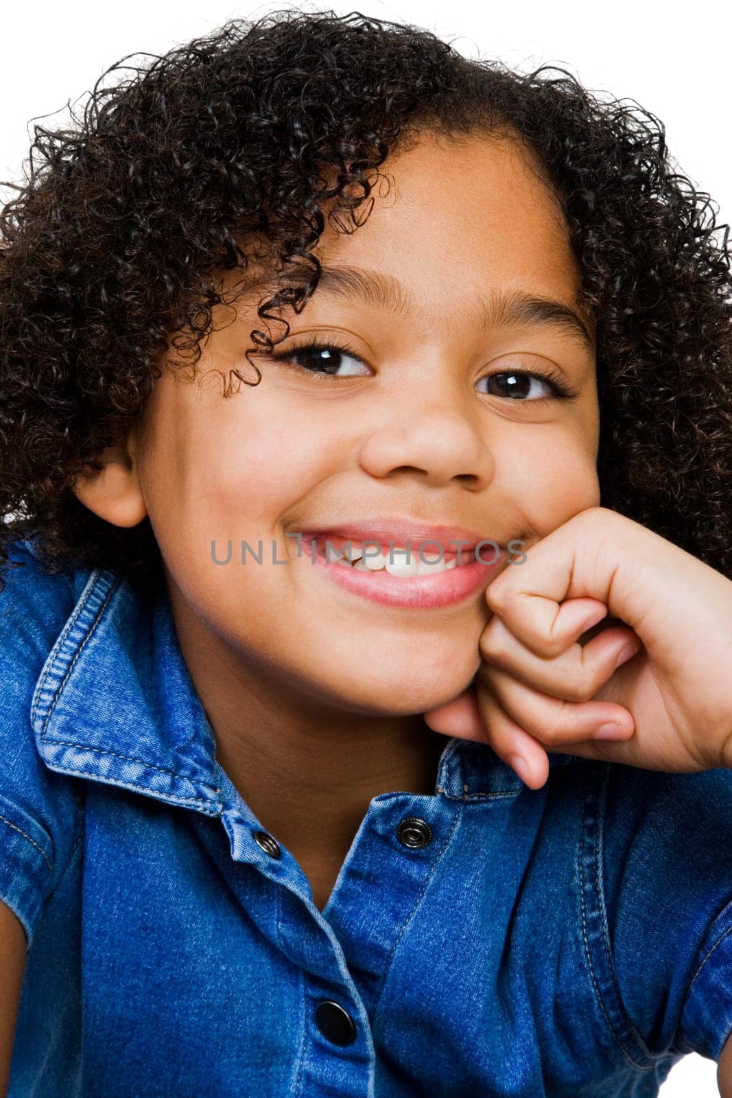 Girl smiling with her hand on chin isolated over white