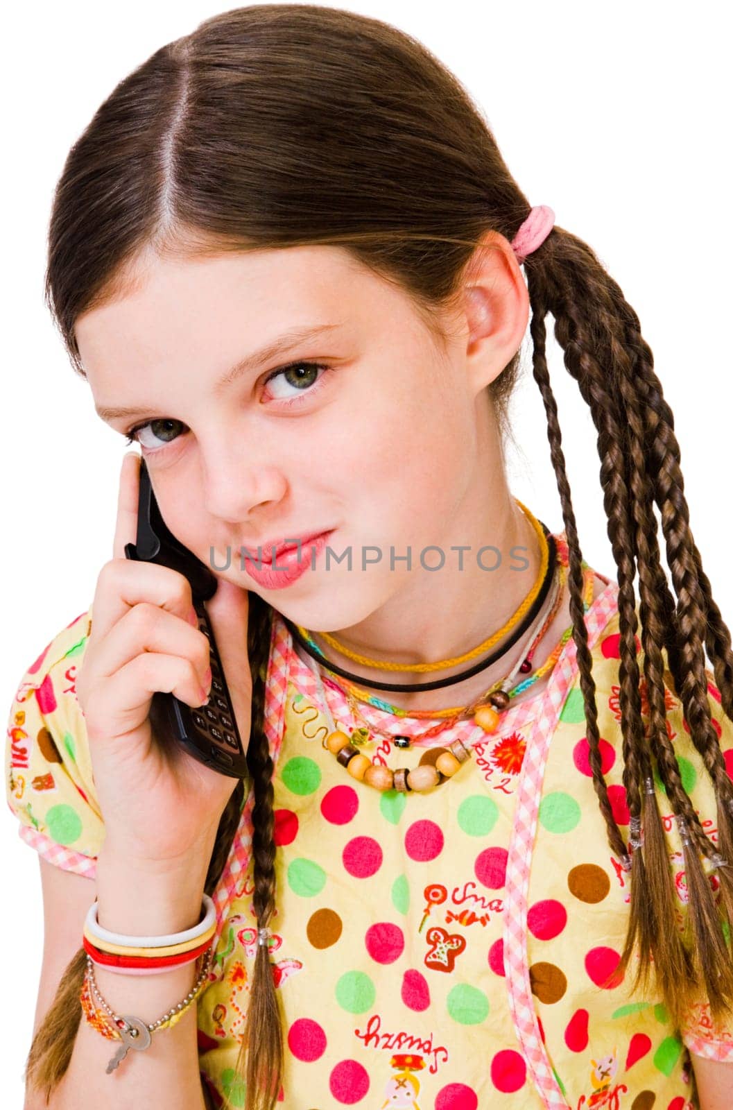 Close-up of a girl talking on a mobile phone isolated over white