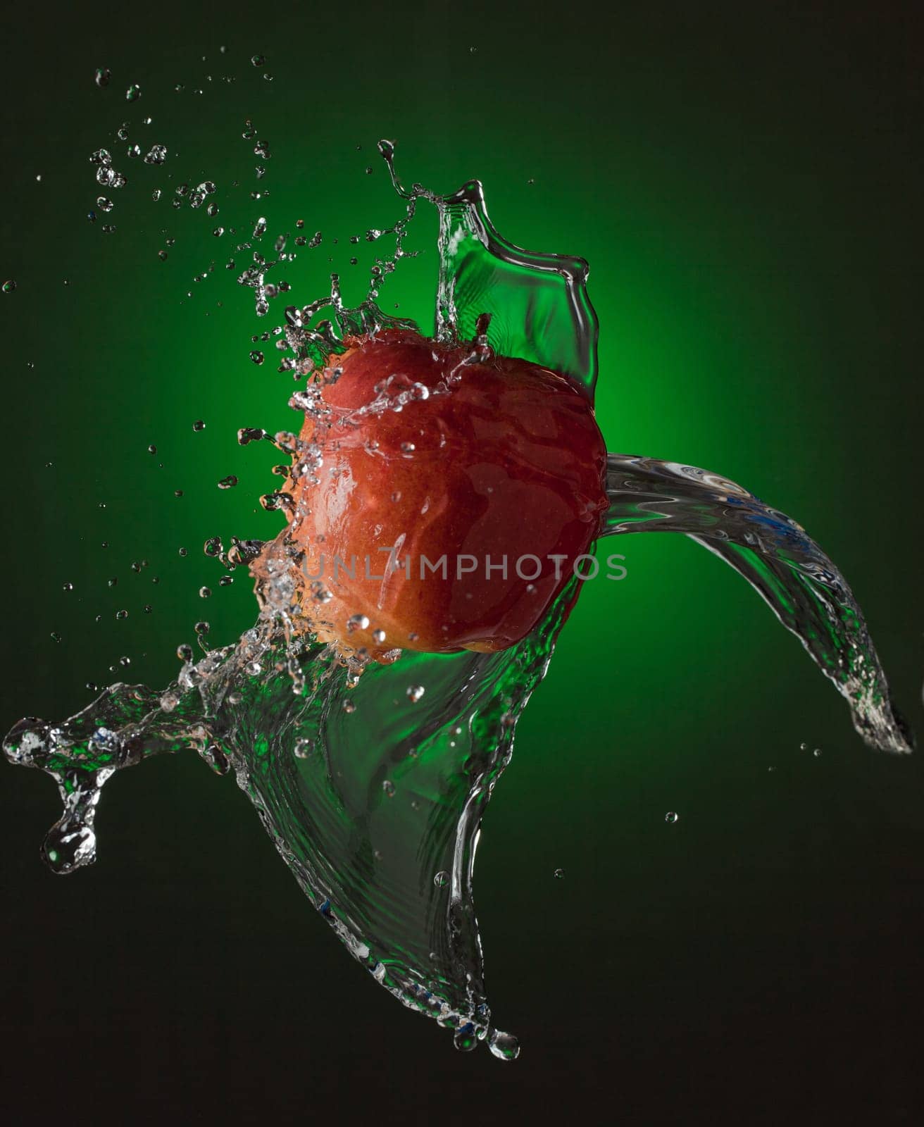Water Splashes on Red Apple