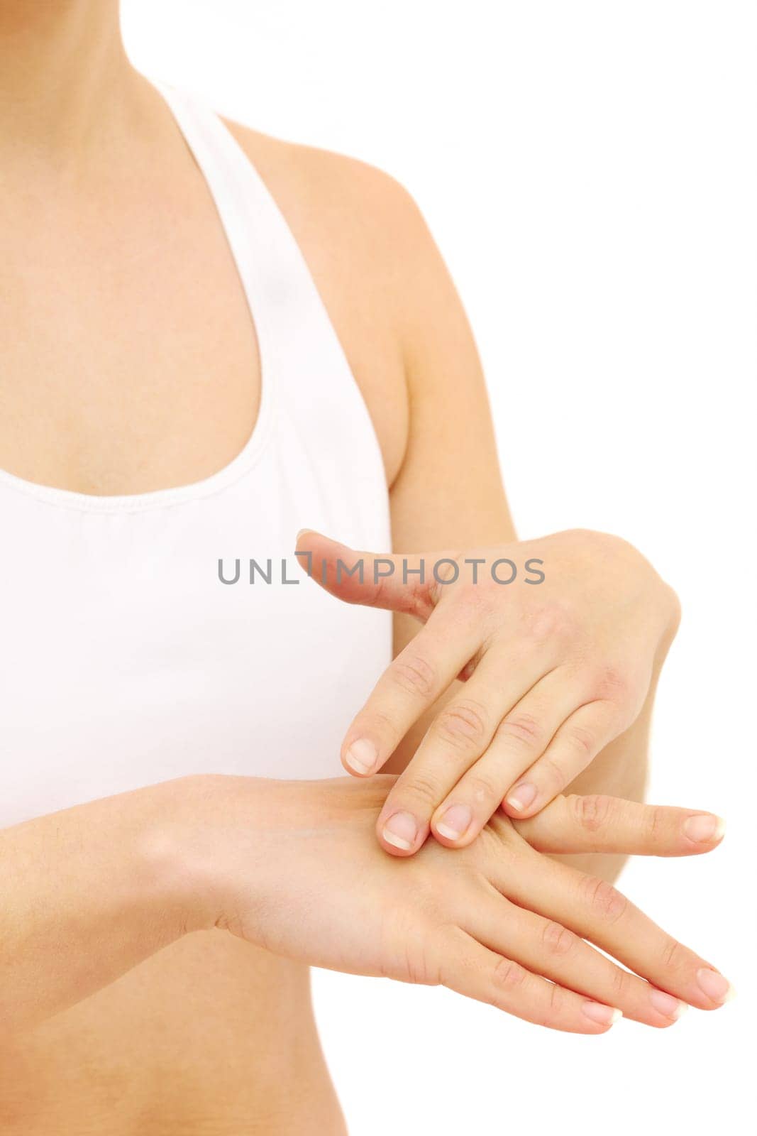 Woman in underwear applies cream on dry hands